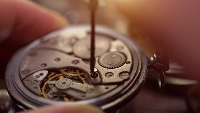 Mechanical watch repair. Watchmaker's workshop. Gear replacement