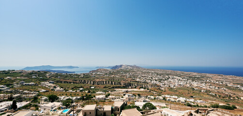 Beautiful panoramic view from the church of Theotakaki (Dormition of the Virgin Mary) in the castle of Pyrgos. In front of us we see the northern part of the island, on our left the caldera.