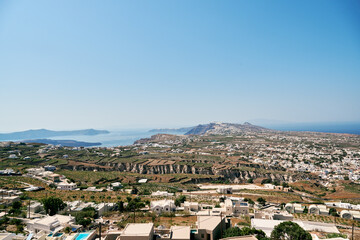 Beautiful panoramic view from the church of Theotakaki (Dormition of the Virgin Mary) in the castle of Pyrgos. In front of us we see the northern part of the island, on our left the caldera.