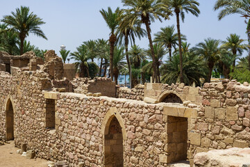 Antick ruins of Aqaba Fortress walls, or Aqaba Castle, Mamluk Castle, Jordan. Fortress was built by Crusaders in the 12th century. Aqaba Castle has quadrangular shape with stone towers at corners.