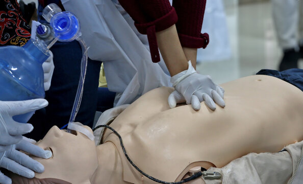 Emergency and first aid class on cpr doll, Cardiac life support
