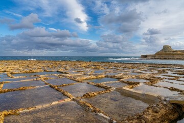 view of the salt pans in Xwejni Bay on the Maltese island of Gozo