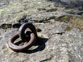 Anchor for a chain imbedded in stone