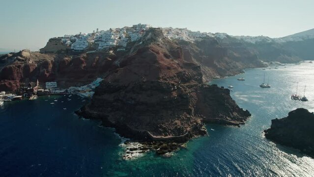 Aerial of the densely populated Oia village on Santorini island with white buildings