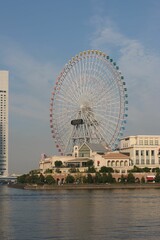 Vertical shot of a large ferris wheel on the shore in Yokohama, Japan