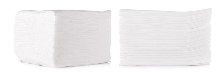 Stack of folded disposable paper tissues on white background.