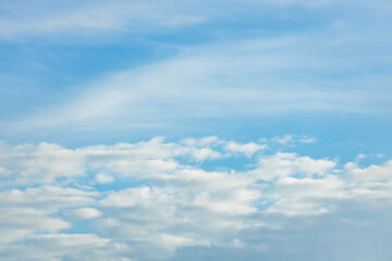 A beautiful sky tinted by the sun leaving vibrant shades of gold, pink, blue and multicolored. Clouds in the twilight evening and morning sky. Cloudy sky background in the evening and during the day.