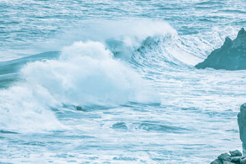 Wave splashing close-up. Crystal clear sea water, in the ocean in San Francisco Bay, blue water, pastel colors.