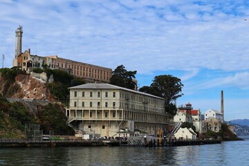 Scenic view of old buildings against a cloudy blue sky on Alcatraz Island, San Francisco