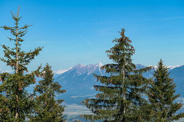 Panoramic view of majestic mountain peak Dobratsch seen from idyllic forestin on Dreilaendereck in...