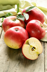 organic red apples on wooden table