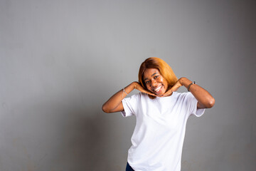 Naklejka premium excited african lady isolated over white background