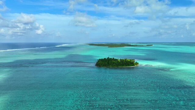 Aerial of little islets in turquoise waters of The Cocos (Keeling) Islands, Australian Territory