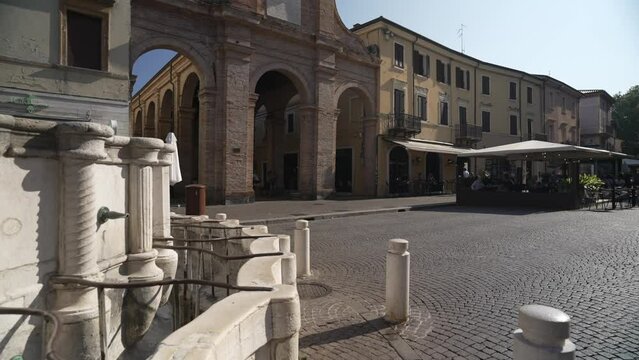 View of fountain, facade of Vecchia Pescheria and restaurant in Piazza Cavour, Piazza Cavour, Rimini, Emilia Romagna