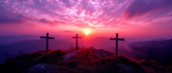 Fototapeten Crucifixion and Resurrection of Jesus at sunset. Three wooden crosses against beautiful sunset in the mountains. Catholicism symbols. Easter concept. © Elena Uve