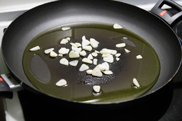 Fish in sauce with shrimp. Step by step preparation. Frying minced garlic