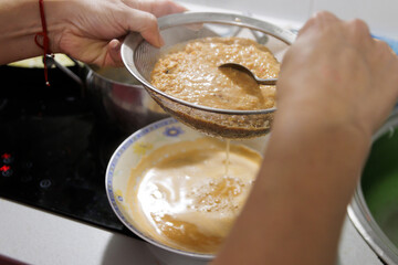 Fish in sauce with shrimp. Step by step preparation. Straining the fumet