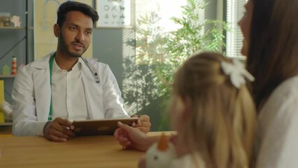 A mother with a preschool-age daughter at a pediatrician's examination.