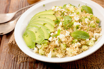 Quinoa salad with goat cheese, cucumber and avocado