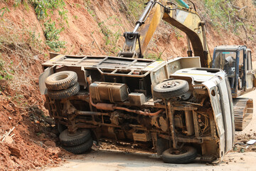 A dump truck that had an accident In the construction area, roads are being pushed with excavators. Feeling unsafe in the construction area