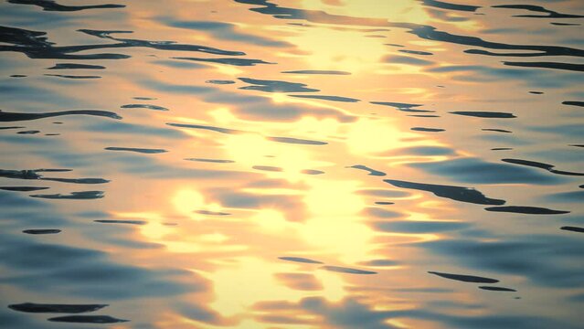 Beautiful reflection golden sun light on blue water, rippled waves, calm natural crystal clean water, fresh, effect, scene, sea, wet, wavy, pool, sunset, shine, slow motion, close up, hd. ProRes 422HQ