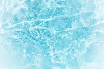 Water surface. Bluewater waves on the surface ripples blurred. Defocus blurred transparent blue...