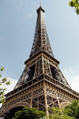 Eiffel Tower in Paris, France, standing tall against a vibrant blue sky.