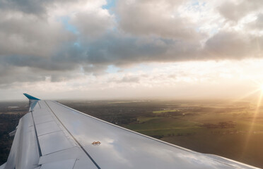 Wing of the plane on blue sky background Space for text. Banner concept