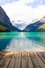 Wooden dock situated on the edge of a picturesque mountain lake, in Banff, Canada