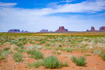 view to scenic buttes at horizon in Monument valley,