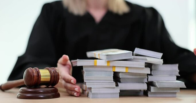 Female judge slams gavel taking pile of banknotes as bribe