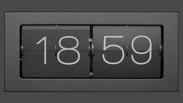 Flip clock quickly flips. Slow motion. Retro flip clock changing from 18:59 to 19:00.