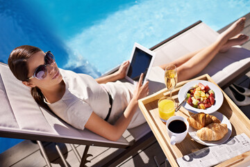 Hotel, pool and woman with breakfast, tablet and relax on business trip for food or drink service....