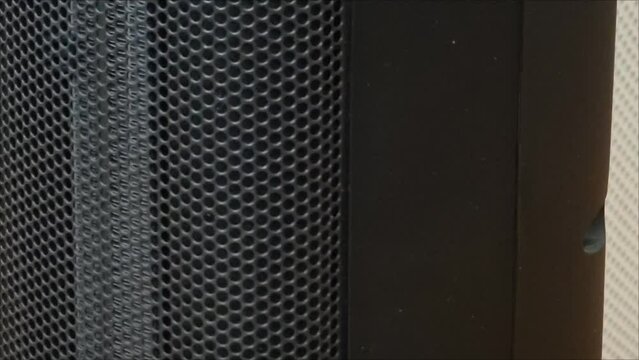 Oscillating ceramic tower electric space heater black mesh cover household heating closeup video