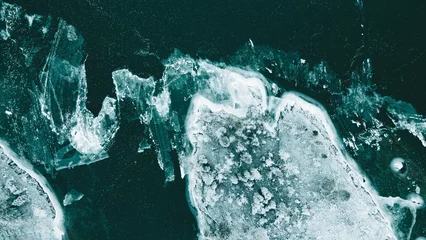 Poster Several ice pieces in a dark and mysterious aquatic environment © Wirestock