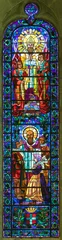 Foto op Aluminium ANNECY, FRANCE - JULY 11, 2022: The modern stained glass with the St. Francis of Sales in St. Pierre Cathedral from 20. cent.  © Renáta Sedmáková