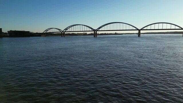 Drone view of the Mississippi River and Centennial Bridge of Rock Island with blue sky