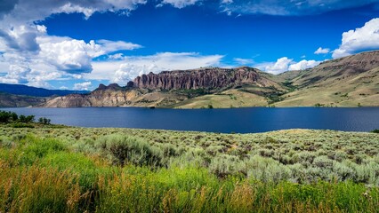 Landscape of a lake surrounded by rolling hills of Curecanti National Recreation Area