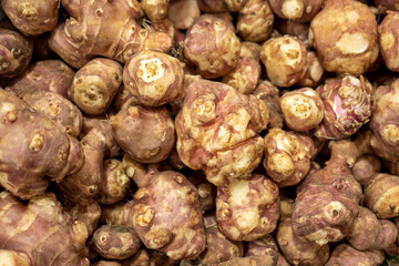 Close-up of a crate of fresh Jerusalem artichokes,