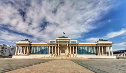 Government Palace under a cloudy blue sky in  Ulaanbaatar, Mongolia.