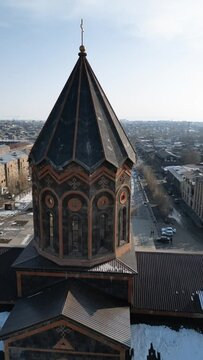 Rotating view over All Saviors Church in Gyumri, Armenia with old buildings