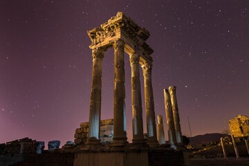 Ancient architectural structure against a starry night sky