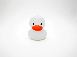 Rubber duck with an orange-colored beak on a white background
