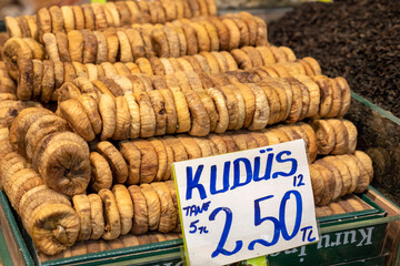 Large dried figs arranged in boxes are sold in the market,