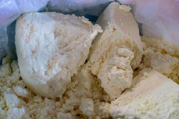 Organic full-fat cheeses offered for sale unpackaged,