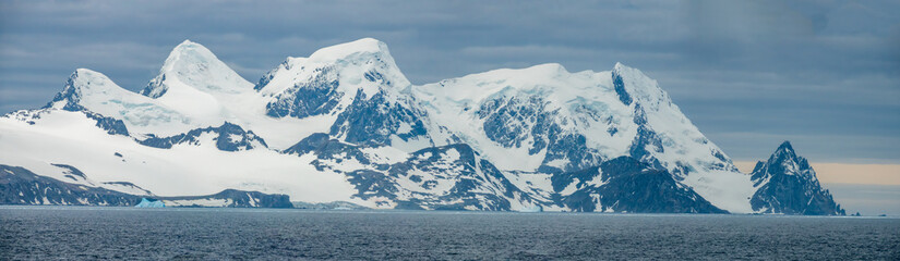 Panoramic view of most of Elephant Island, Antarctica. It shows the difficult coastal terrain and...