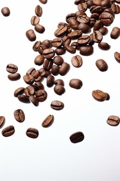 Freshly Roasted Coffee Beans Cascading on a Clean White Background - High-Quality Image for Commercial Use