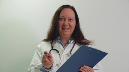 Portrait of smiling empathic professional senior woman doctor consulting patient looking at camera. Online medicine, consultation, internet appointments concept. Medical specialist enjoys job, work.