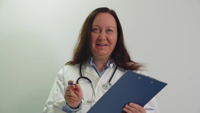 Portrait of smiling empathic professional senior woman doctor consulting patient looking at camera. Online medicine, consultation, internet appointments concept. Medical specialist enjoys job, work.