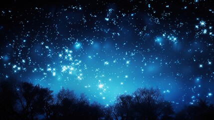 Fototapeta na wymiar Landscape showing trees against a magical, starry night sky full of stars